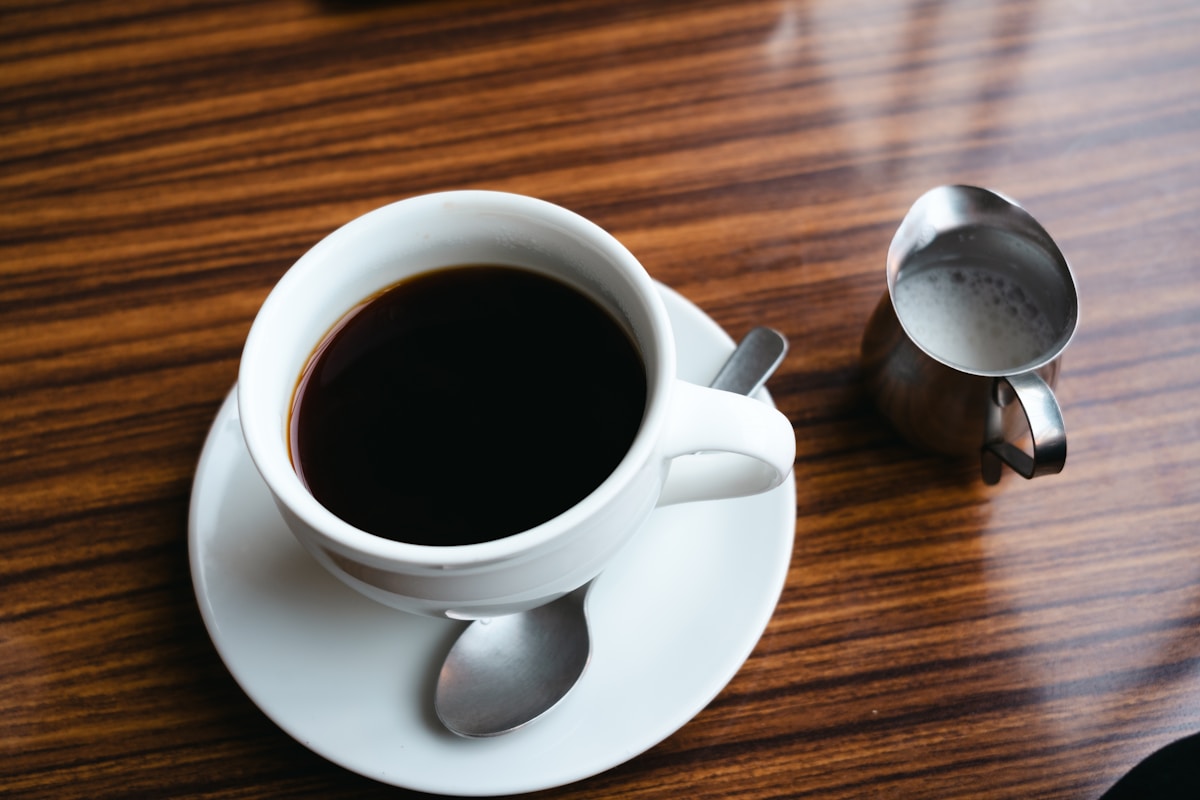 Cup of mushroom coffee on wooden table